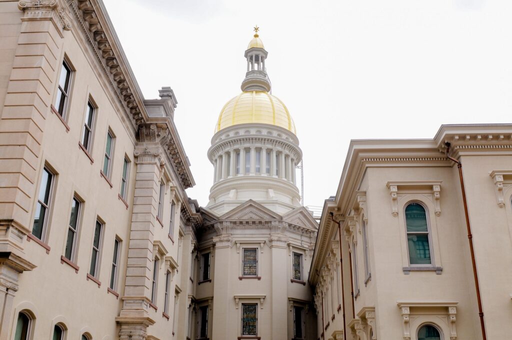 State, unions agree to $75 million in public worker health plan cuts