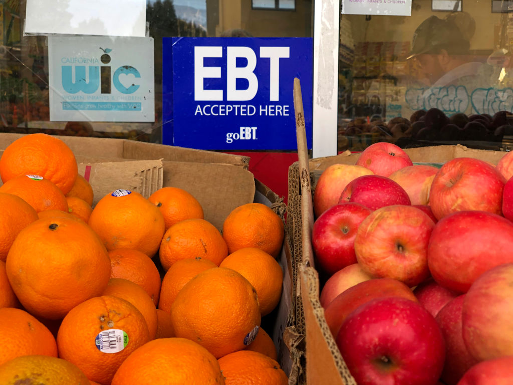 The Trump administration wants everyone to reapply for food stamps. What does that mean? An Oakland, Calif., grocery store displays a sign notifying shoppers that it accepts electronic benefit transfer cards.