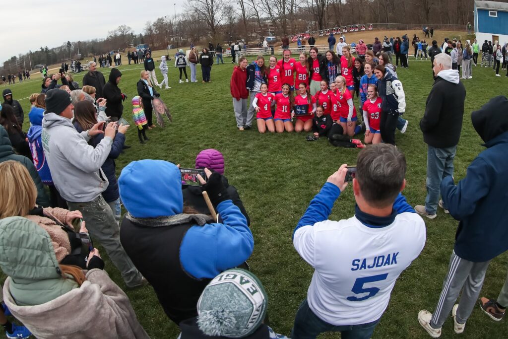 Kittatinny's girls soccer team poses for cameras after a win in 2024. The regional school district is considering a merger with four other districts.