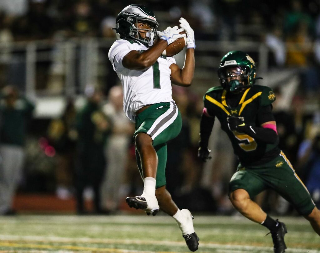 Jayion Moss (1) of Winslow catches a pass behind Mason Koch (5) of Red Bank Catholic for the go-ahead and game-winning touchdown late in the game during the football game between Red Bank Catholic and Winslow at Count Basie Park Stadium in Red Bank, NJ on 10/3/26.